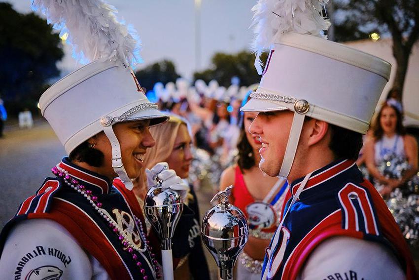 Jaguar Marching Band member smiling at each other